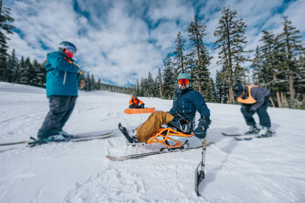 istock Adaptive athlete sit-skiing with friends 1483948275