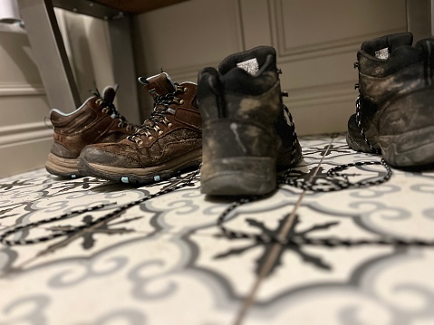 Walking boots on a tiled floor
