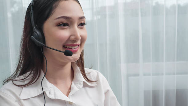 istock Young enthusiastic female customer support operator put on headphone. 1483953982