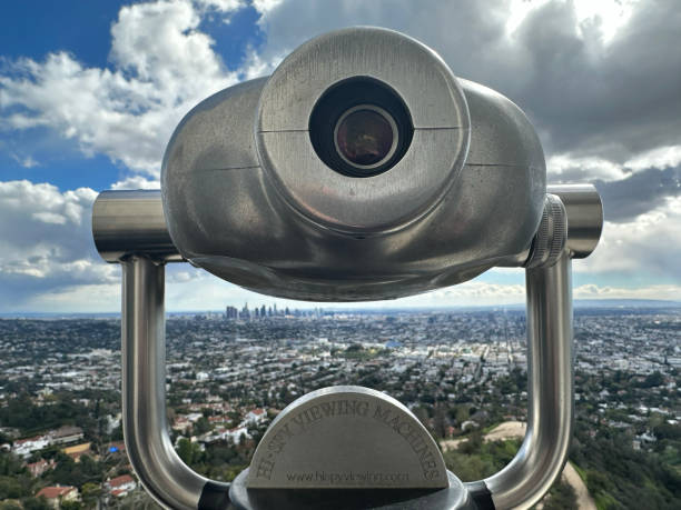 Viewing scope at Griffith Observatory Viewing scope and view of Los Angeles from Griffith Observatory griffith park observatory stock pictures, royalty-free photos & images