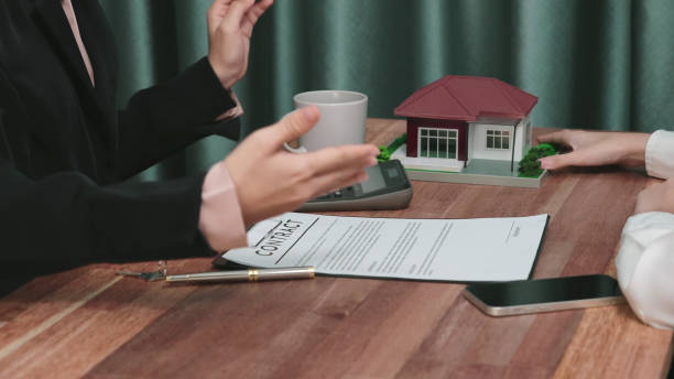 istock Closeup enthusiastic customer review contract paperwork for house loan. 1483955335