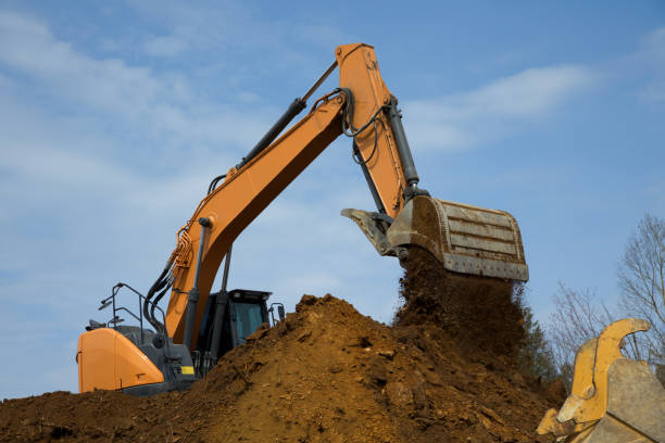 istock backhoe digging hydraulic shovel on construction site earth mover excavator dumping earth 1483973077