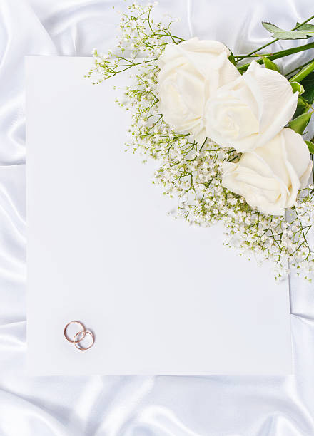 istock Wedding rings with a roses and invitation 148397606