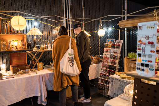 Seattle, USA - Mar 25, 2023: Late in the day the Fremont Night Market begins under the Fremont bridge,