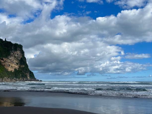 istock beach with cliff at sunny day 1483984804
