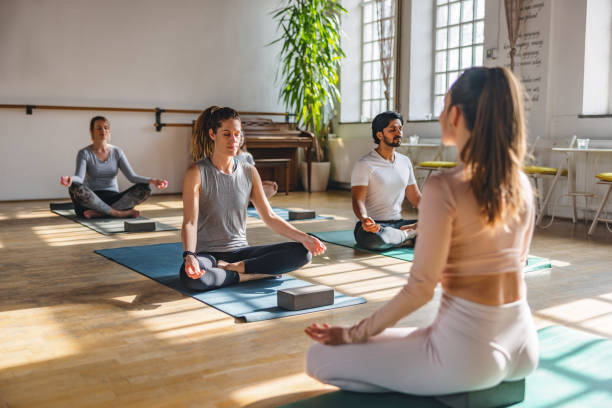 istock A Diverse Group Of People Meditating During A Yoga Class In A Beautiful Studio With Natural Light 1483989718