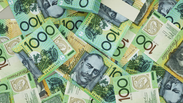 istock close up of 100 Australian dollar notes spread on table. 3d rendering on money scattered on surface 1483993931