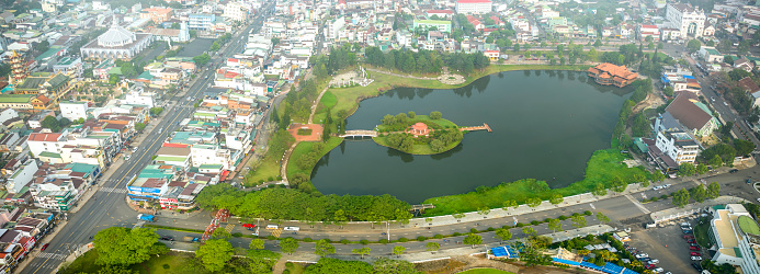 Aerial view of Bao Loc city, Vietnam beautiful tourism destination in central highlands. Urban development texture, green parks and city lake