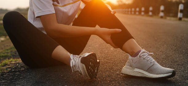 istock Ankle calf cramps accident in sport exercise running jogging.low key lighting. 1484001140