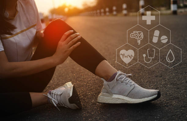 istock Ankle knee accident in sport exercise running jogging.low key lighting. 1484001143