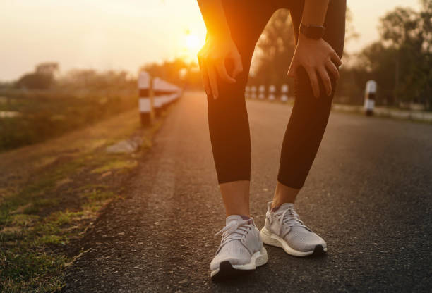 istock Ankle knee accident in sport exercise running jogging.low key lighting. 1484001151