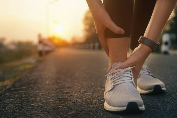 istock Ankle twist sprain accident in sport exercise running jogging.low key lighting. 1484001163