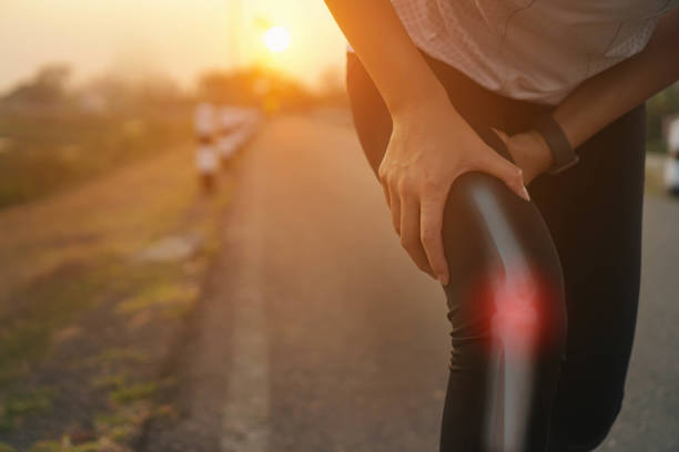 istock Ankle knee accident in sport exercise running jogging.low key lighting. 1484001171