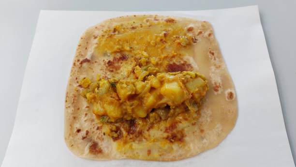 istock Roti with spicy Indian vegetarian curry spread on table 1484002018