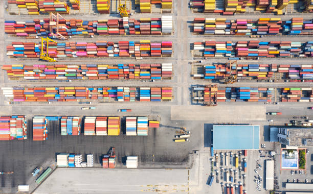 istock Top view Logistics and transportation of Container Cargo ship and Cargo plane with working crane bridge in shipyard at sunrise, logistic import export and transport industry background 1484004194