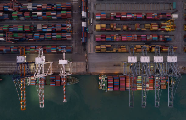 istock Top view of International Container ship loading, unloading at sea port, Freight Transportation, Shipping,  Vessel. Logistics, import export, Transportation. Global transport business. 1484004201