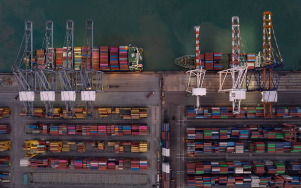 istock Top view of International Container ship loading, unloading at sea port, Freight Transportation, Shipping,  Vessel. Logistics, import export, Transportation. Global transport business. 1484004202