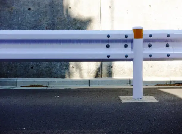 It is a guardrail to make the road safe for pedestrians.