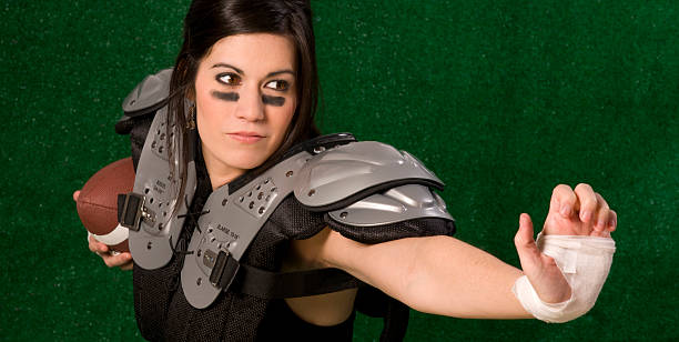 istock Stiff Arm Given in Foward Motion by Geared Female PLayer 148400863