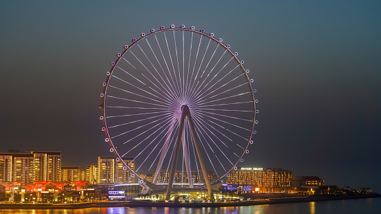 Dubai, United Arab Emirates. Amazing view of the Ain Dubai at night. The world’s tallest and largest observation wheel. An iconic landmark. The Ferris wheel illuminated at night