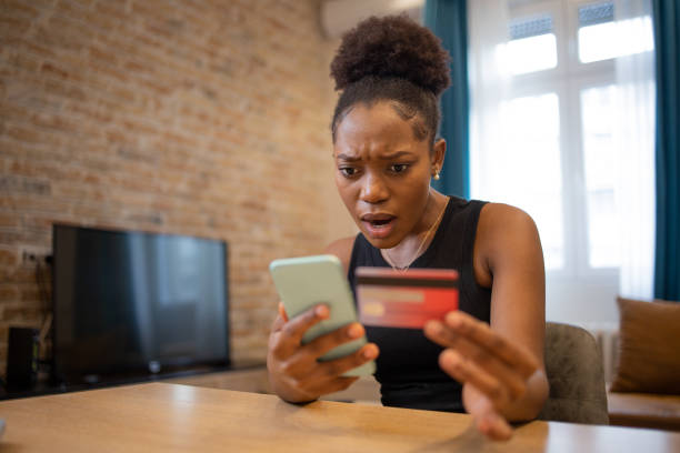 istock Cheerful  woman doing online shopping 1484017833
