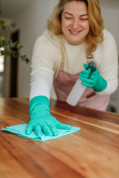 istock A smiling woman cleans up 1484018237