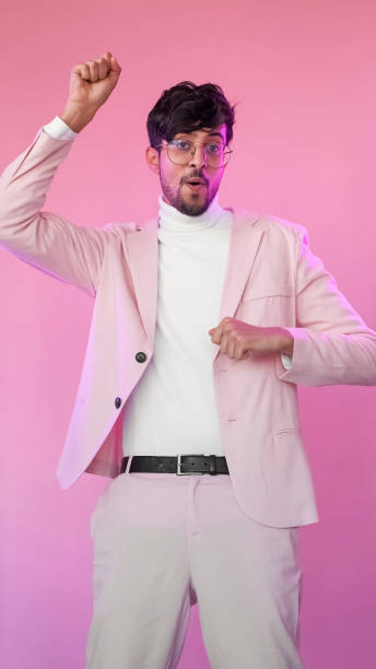istock Excited man success celebration pink guy dancing 1484018476