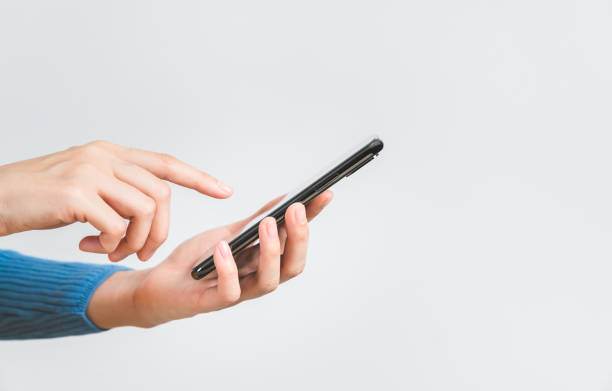 woman hand holding smartphone on white background.