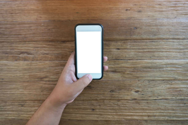 istock Women's hands holding cell telephone blank copy space screen. smart phone with technology concept. 1484022096