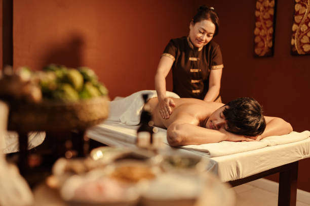 istock Relaxation Asian man customer get service aromatherapy massage with masseuse in spa salon. 1484025997