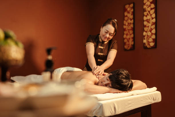 istock Relaxation Asian man customer get service aromatherapy massage with masseuse in spa salon. 1484026008