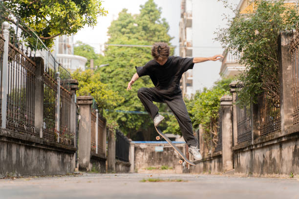 istock A happy young man skateboarding on the road 1484026650