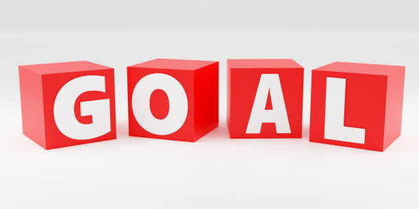 istock Red cubes inscription goal on grey podium, soft light, smooth background, 3d rendering 1484027480