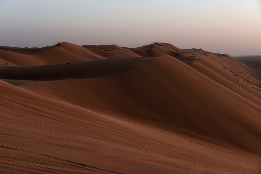 Sunset over sand dunes of Oman