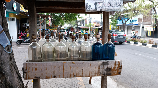 a gasoline in the bottle for sale, blur background. Surabaya, East Java, Indonesia. December 18, 2022
