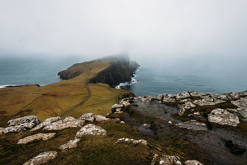 Neist Point a famous lighthouse in Scotland that can be found on the most westerly tip of the Isle of Skye near the township of Glendale. foogy day