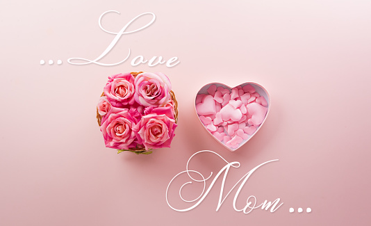 Happy mother's day and love decoration background concept made from hearts and rose on pastel pink background.