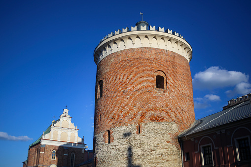 Nysa, Poland - May 1, 2022: Zibice Tower. Medieval gate tower. A gothic building made of red bricks. The view from Bolesaawa Krzzywoustego street