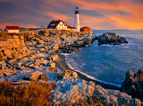Portland Head Lighthouse at sunset on the rocky Maine Coastline