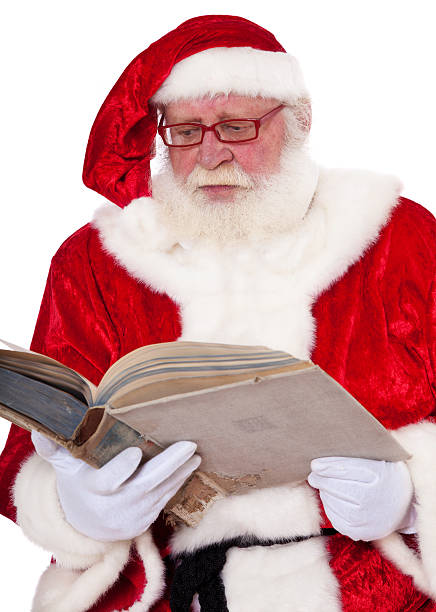 istock Santa Claus reading in old book 148404686