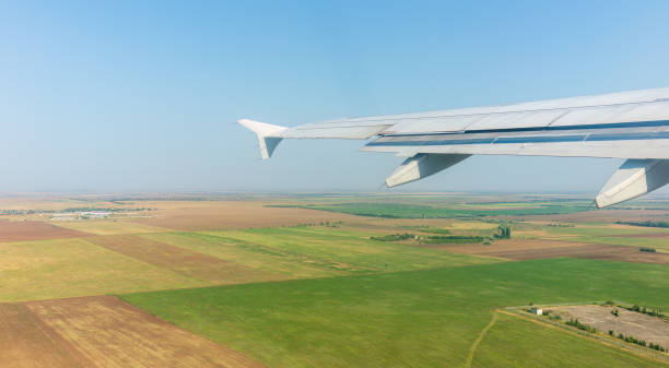 istock View from the airplane window during taking off on a clear summer morning 1484047491