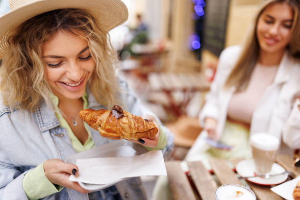 istock Enjoying coffee and croissants at favorite cafe 1484053048