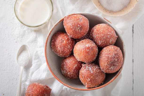istock Hot mini doughnuts as a tasty snack. 1484054243