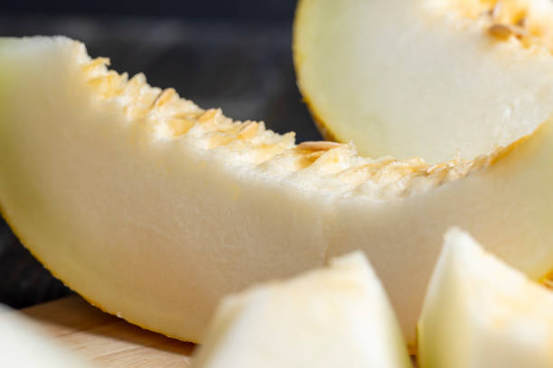 istock Sliced orange sweet melon close up 1484055764