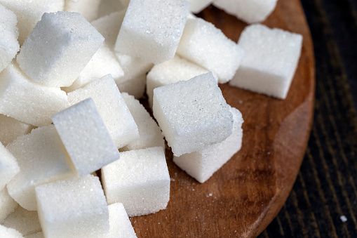 Refined white beet sugar, cubes of white sweet sugar from sugar beet