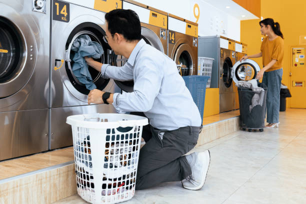 istock Asian people using qualified laundry machine in the public room. 1484061256