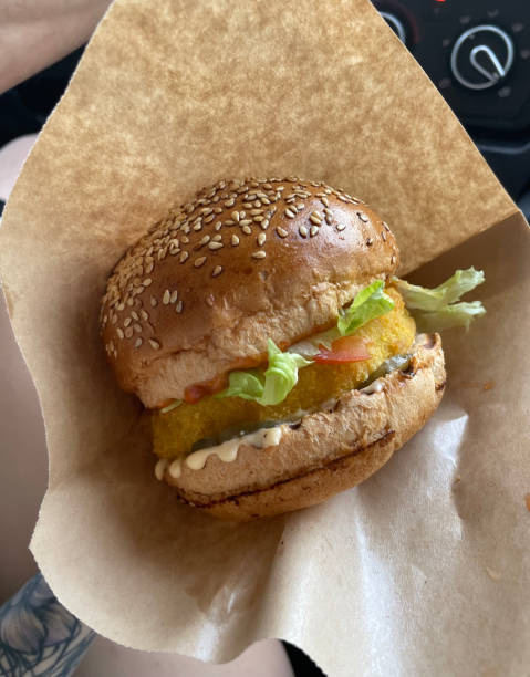 istock Tasty burger in brown kraft paper 1484061275