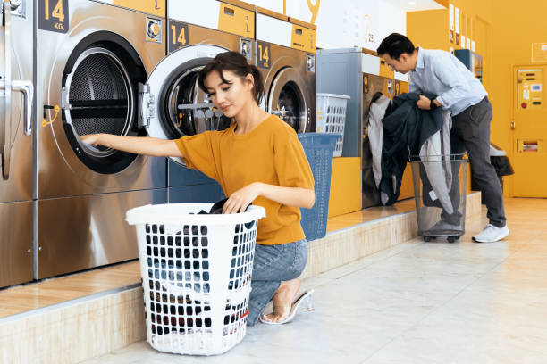 istock Asian people using qualified laundry machine in the public room. 1484061335