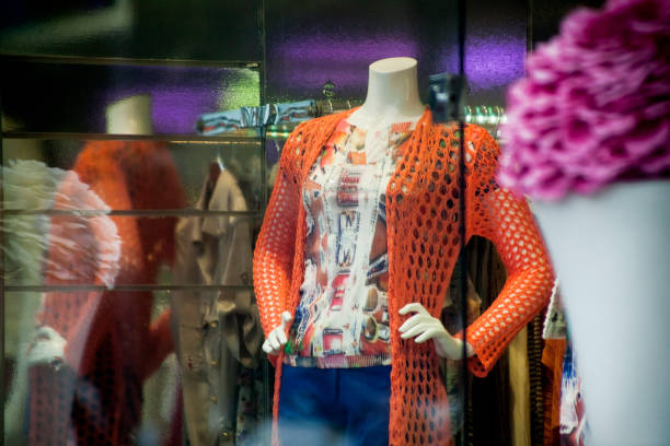 istock Mannequin in clothing store window. 1484061384