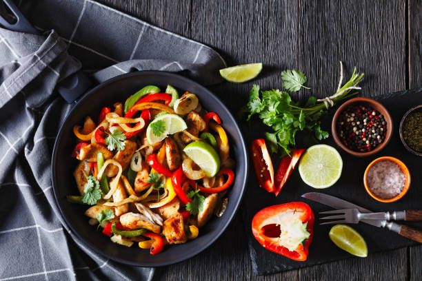 istock chicken fajitas with bell peppers, onion, spices 1484061410